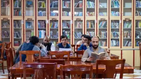 Afghanistan's rulers ban textbooks produced by women from the nation's universities